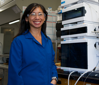 Professor Marie Heffern alongside an Agilent 1260 Infinity II LC System (courtesy of UC Davis).