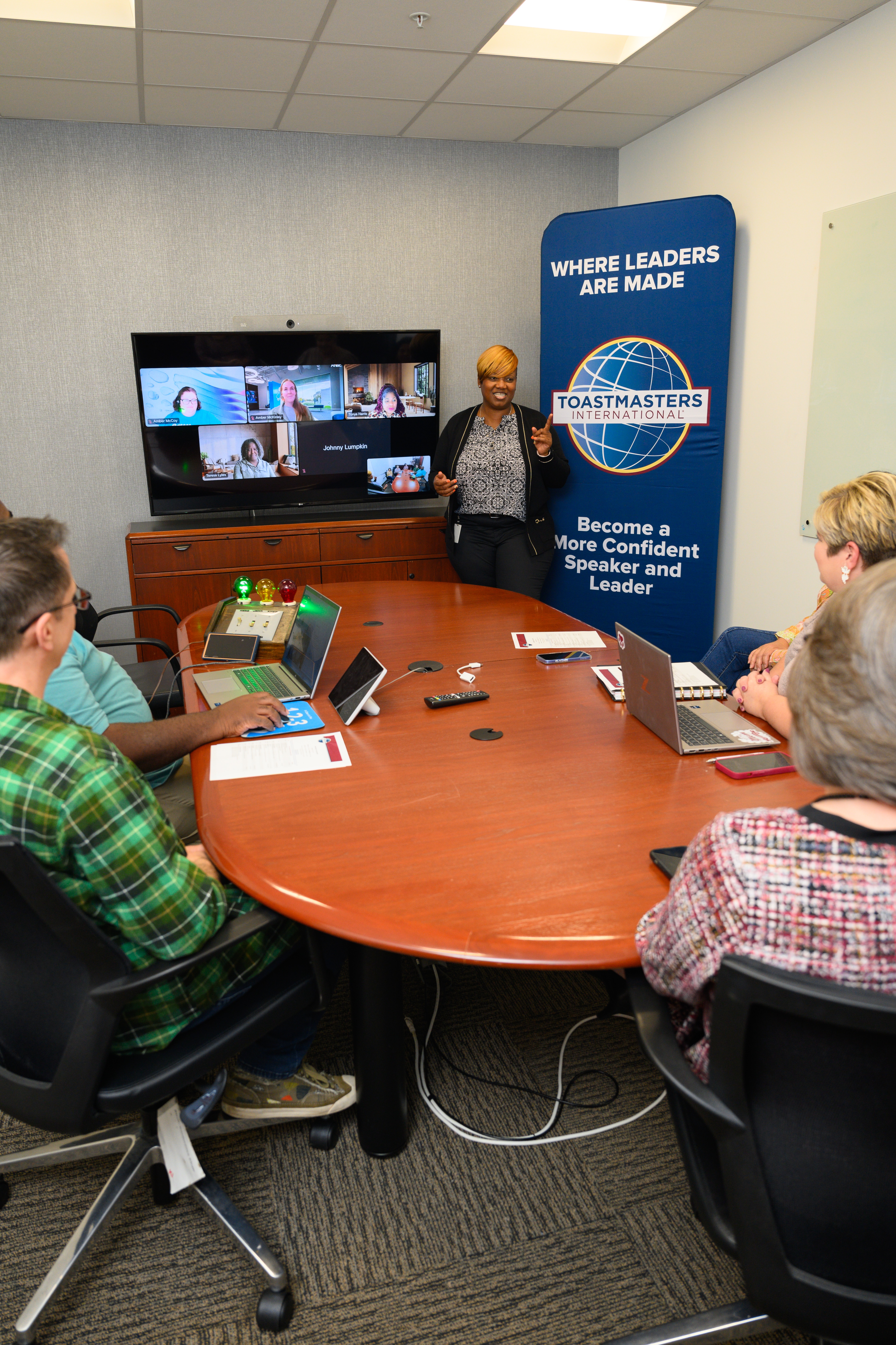 Five Aflac employees having a work discussion