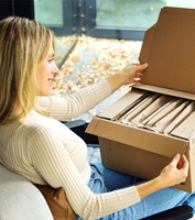 The Pad’it!™ is a fully automated solution that inserts a paper cushioning pad at the top (pictured) and/or bottom of a package to ensure product protection and offer an elevated unboxing experience. (Photo: Business Wire)